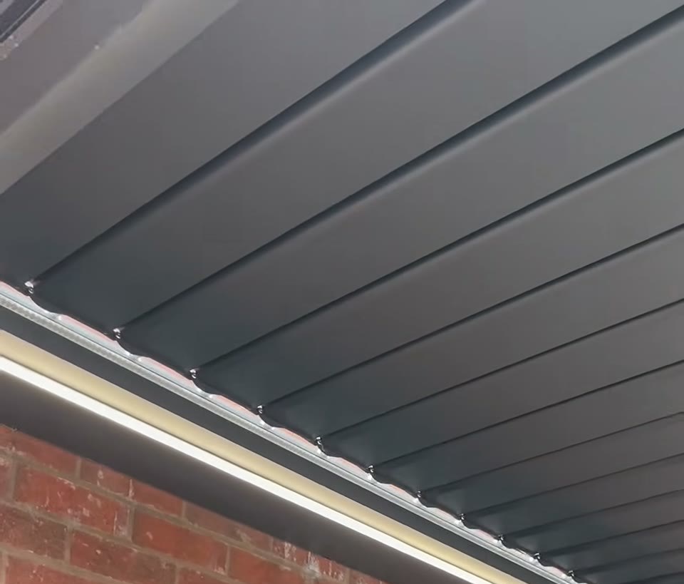 Pagoda roof with electric louvres and a light in the frame